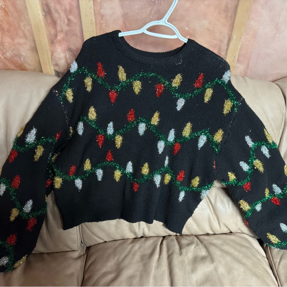 Festive Black Holiday Sweater with Colorful Light Pattern